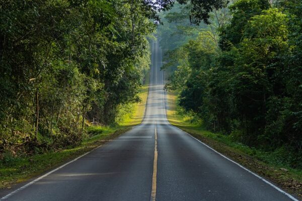 A road down and uphill for a journey